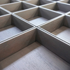 Grooved wood veneer and open compartments for cabinets