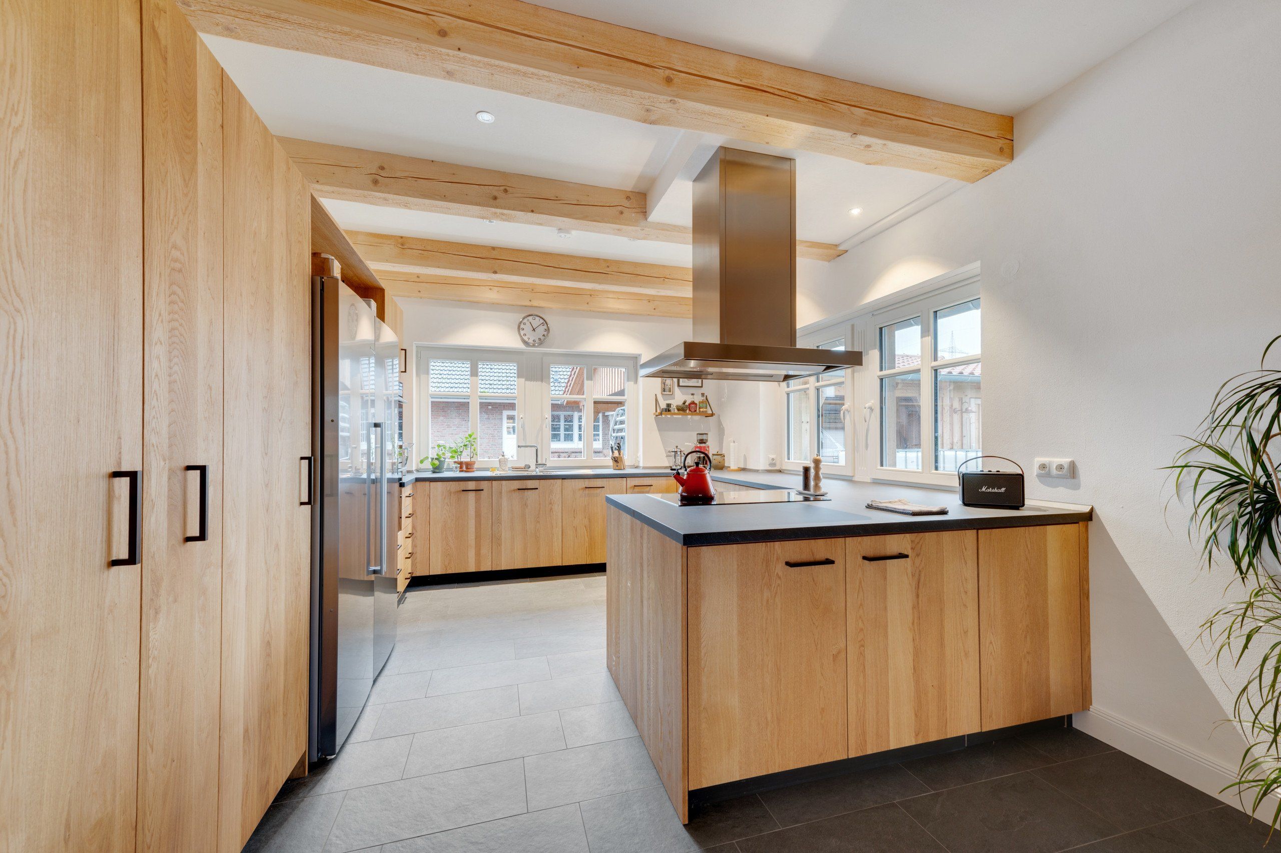 Modern wood kitchen cabinets with natural wood grain finish